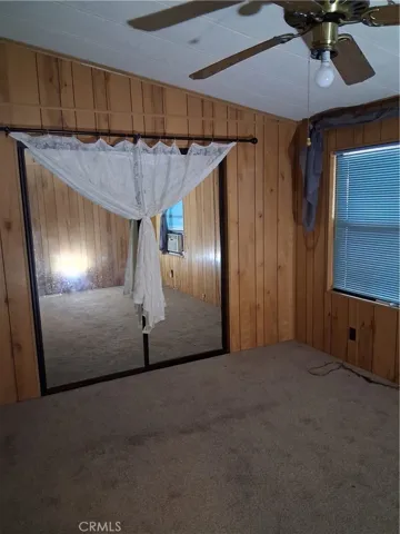 Primary bedroom with mirrored closet space