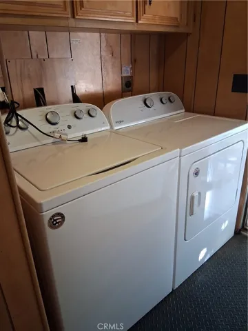 Inside laundry with washer and dryer included