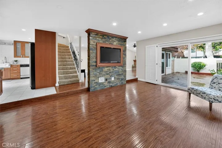 Stunning stone accent wall creates a warm focal point for entertaining