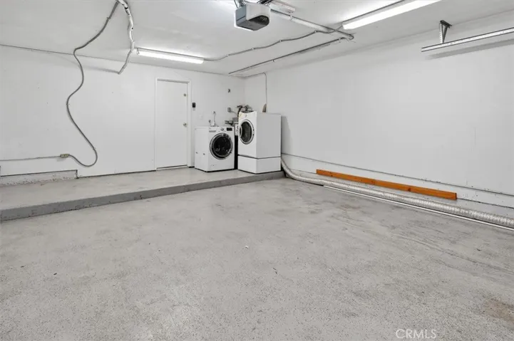 Attached two-car garage for convenient parking and storage. and Laundry Space.