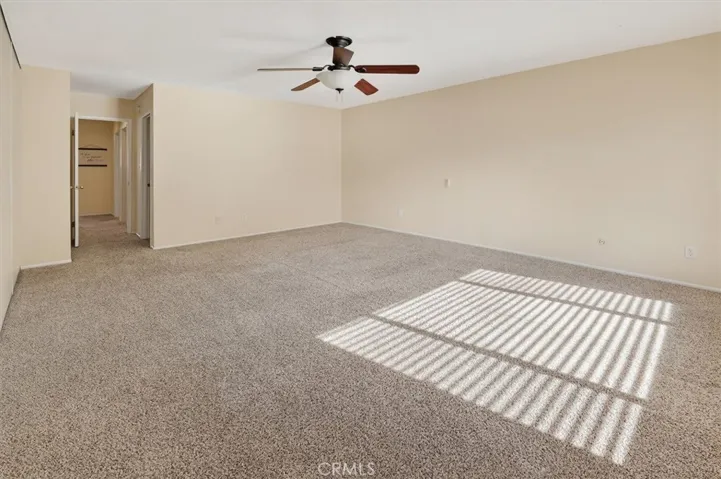 Oversized primary suite with space for a sitting area or study.