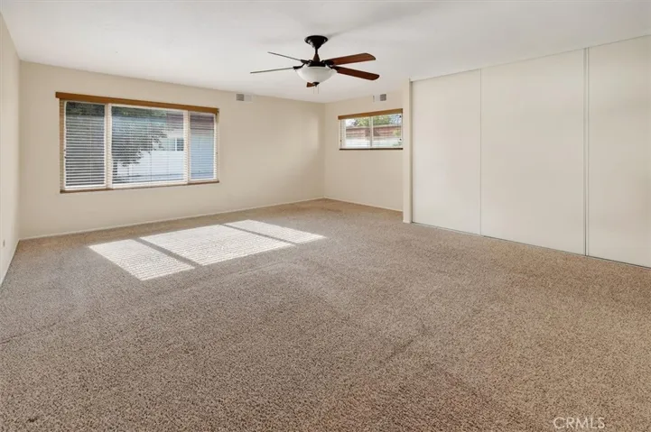 Oversized primary suite with space for a sitting area or study.