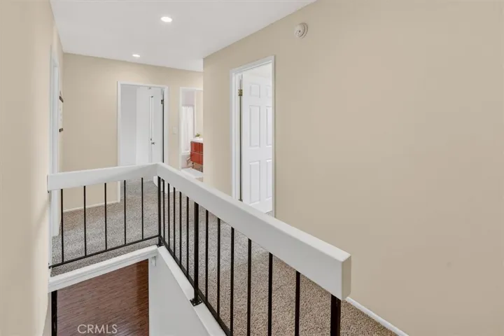 Open and bright upper hallway connecting bedrooms