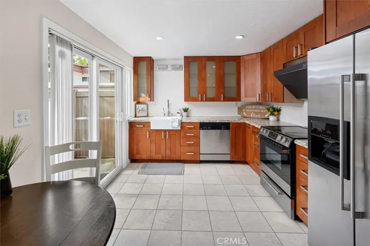 Updated kitchen with warm wood cabinetry and ample counter space