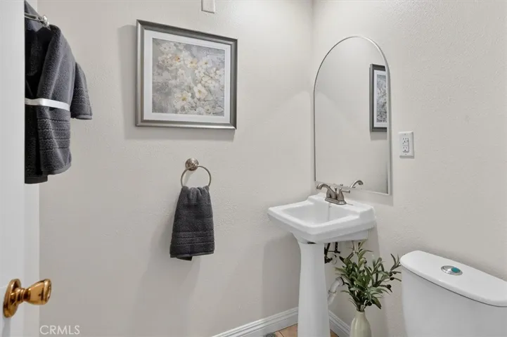 Tastefully appointed half bath with clean finishes.