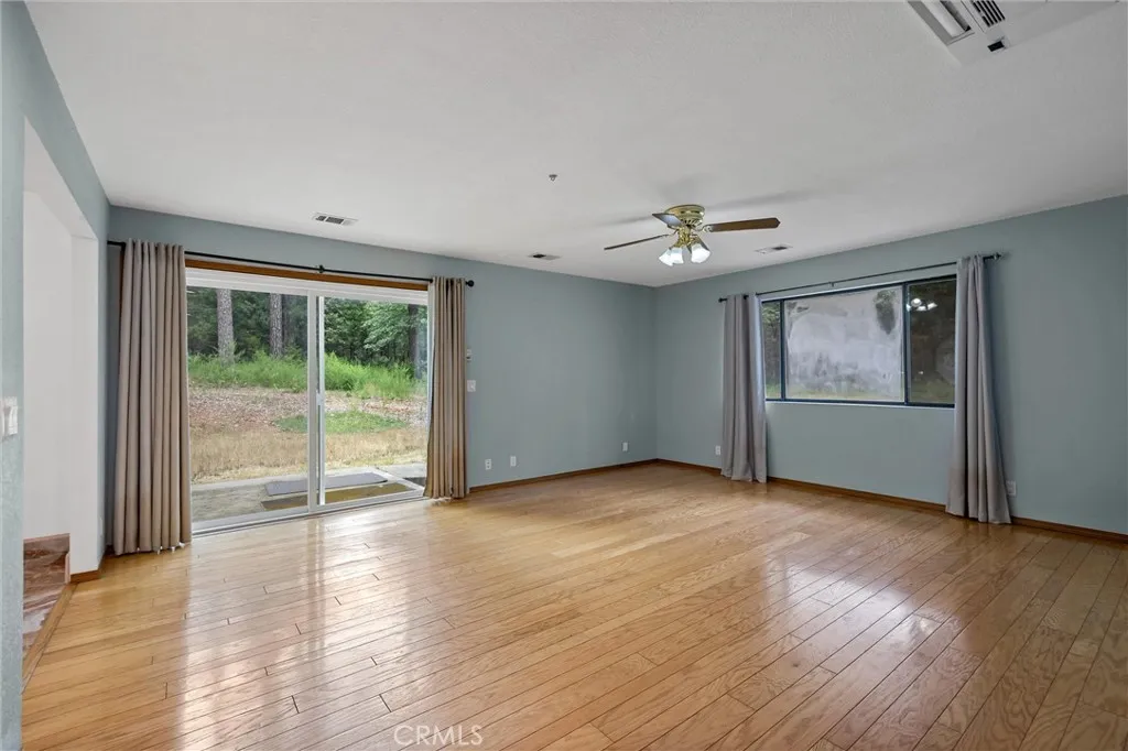 Primary bedroom with sliding door access to back yard