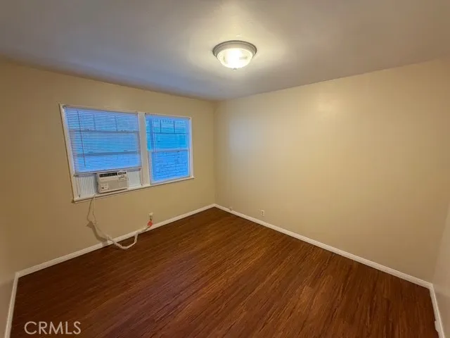 Large bedroom with new window air conditioner