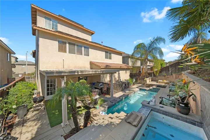 Back yard with pool and jacuzzi and California Room (outdoor patio)