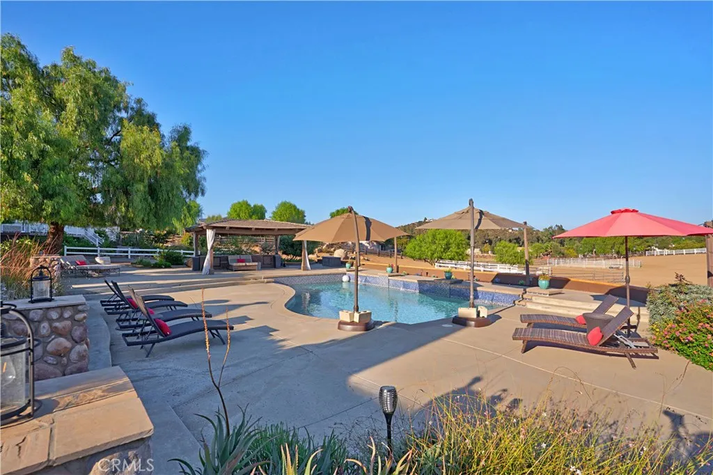 Resort-Style Pool Area with area for loungers and space to enjoy the beautiful property views
