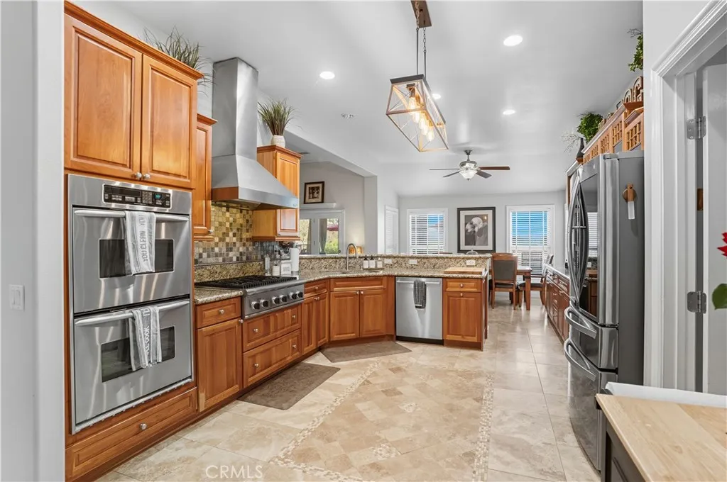 Main Home - Chef's Kitchen with Stainless Steel Appliances, Double Oven, 6 Burner Stove, and spacious cabinetry