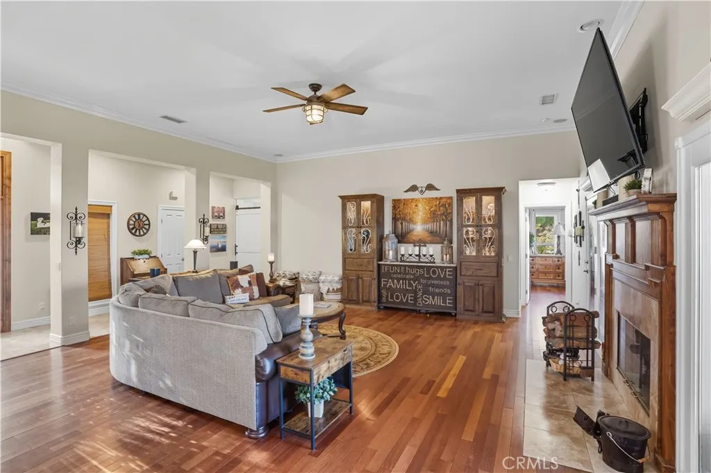 Main Home - Open Concept family room with elevated ceiling & beautiful hardwood flooring