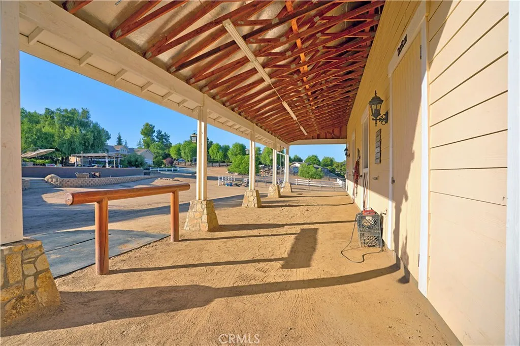 Shedrow barn with hitching post and attachments for cross-ties