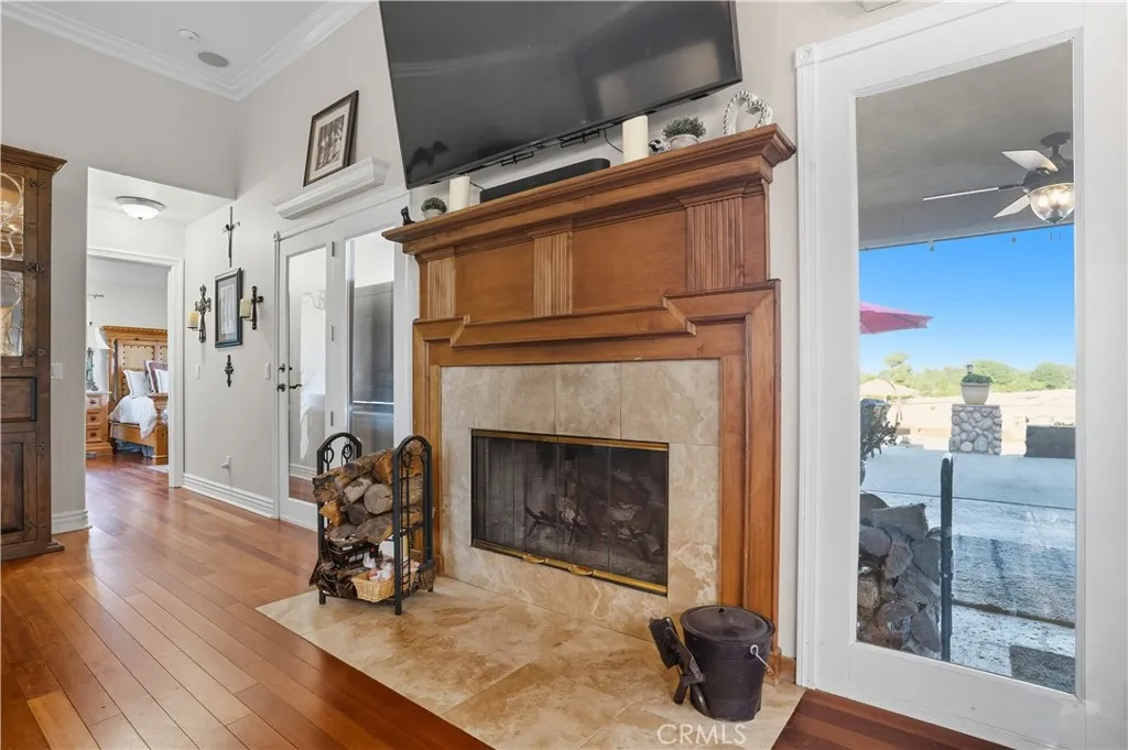 Main Home - wood burning fireplace with custom hearth and mantle