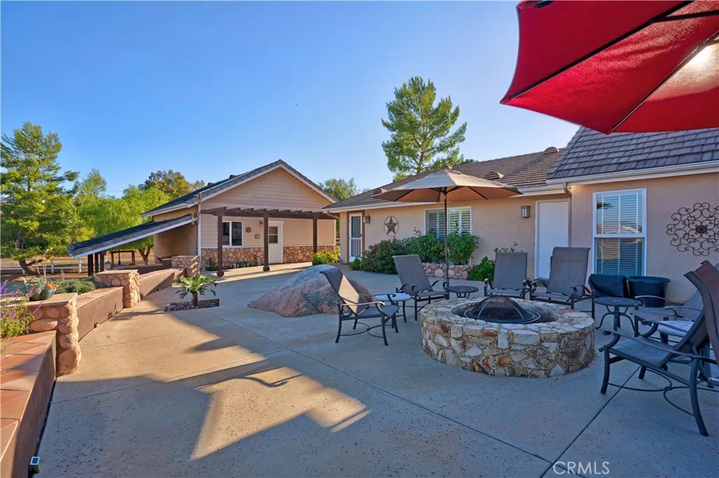 Main Home - Firepit area and large patio space for entertaining and enjoying sunrises