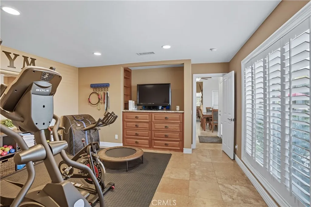Main Home - Flex Space - currently being used as a gym - has built-in dresser, so could be used as 4th bedroom