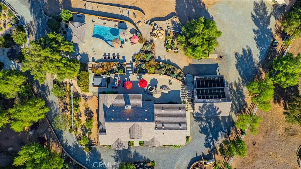 Aerial of main home with pool and entertaining area