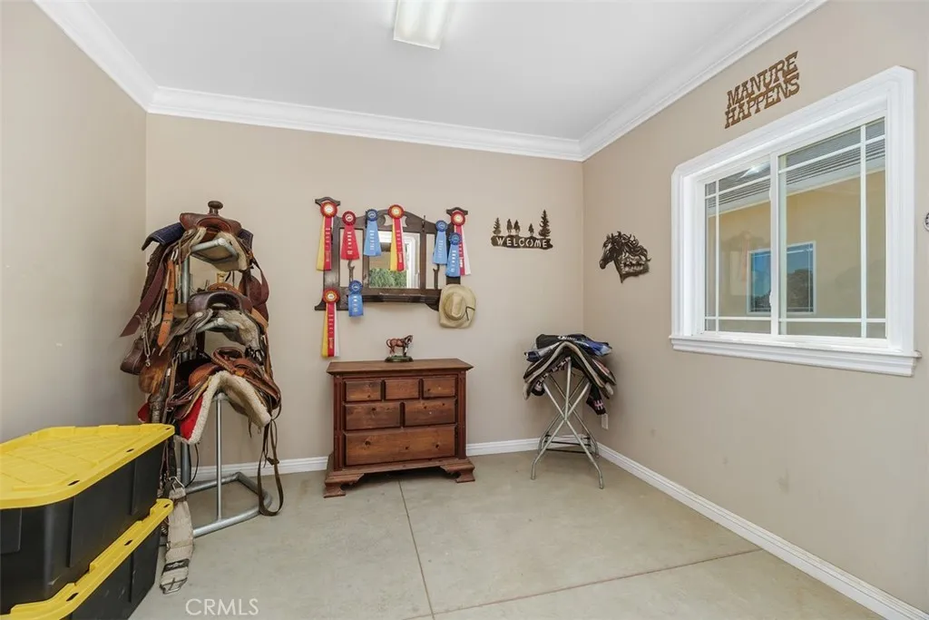 Custom Tack Room with Crown Molding and Large Baseboard