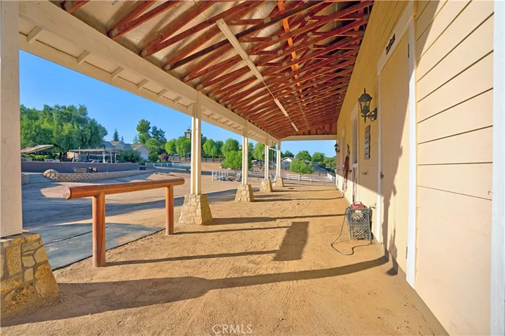 Shedrow barn with hitching post and attachments for cross-ties