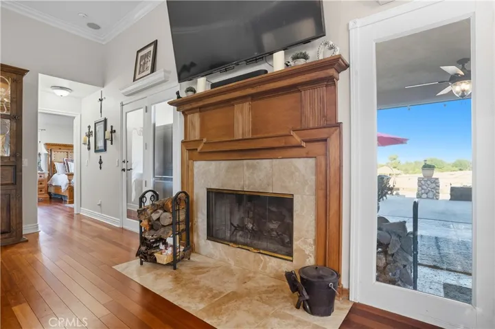Main Home - wood burning fireplace with custom hearth and mantle