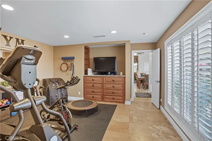 Main Home - Flex Space - currently being used as a gym - has built-in dresser, so could be used as 4th bedroom