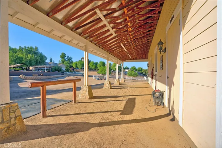 Shedrow barn with hitching post and attachments for cross-ties