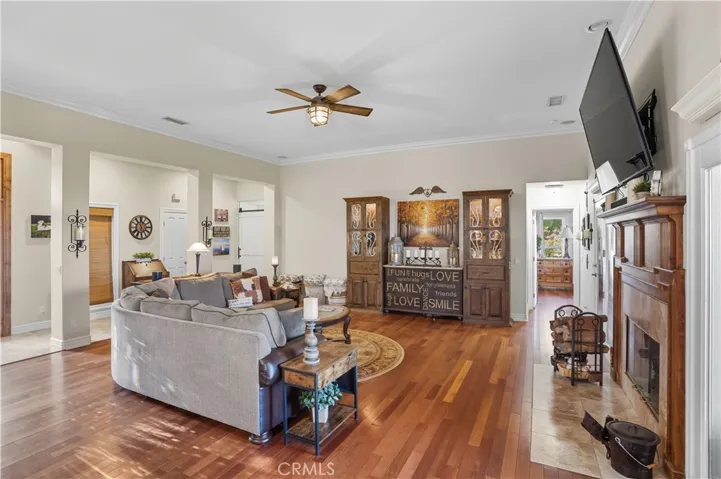 Main Home - Open Concept family room with elevated ceiling & beautiful hardwood flooring