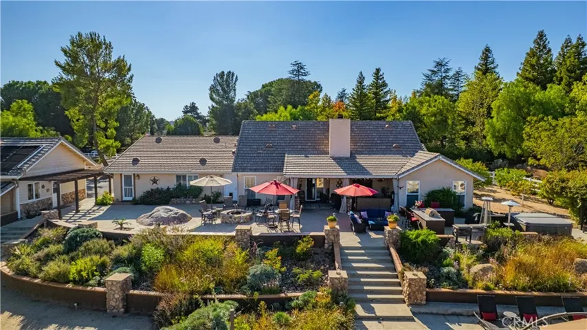View of Rear of Main Home with Beautiful Floral areas and elevated areas perfect for entertaining and enjoying La Cresta Views
