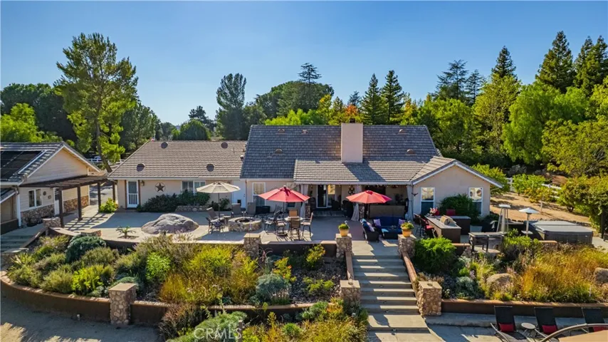 View of Rear of Main Home with Beautiful Floral areas and elevated areas perfect for entertaining and enjoying La Cresta Views