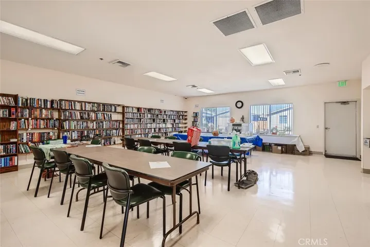 Craft room with sewing machines, ceramics facilities, library and ping pong table.