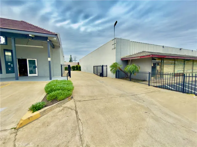 electronic gate to access the rear parking lot and trash enclosure