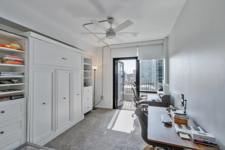 WHITE MURPHY BED MAKES USE OF THE SPACE PERFECTLY.ACCESS THE BALCONY FROM THE PRIMARY BEDROOM AND GUEST BEDROOM