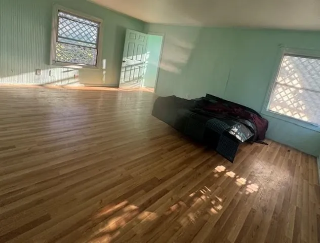 Bedroom with wood finished floors
