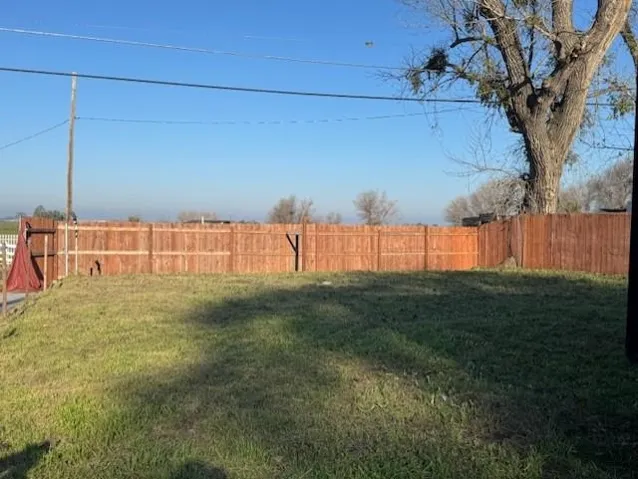 View of fenced backyard