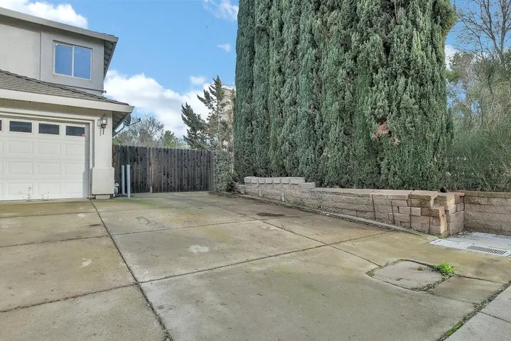 Garage with concrete driveway
