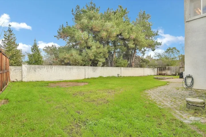 Fenced backyard featuring a patio area