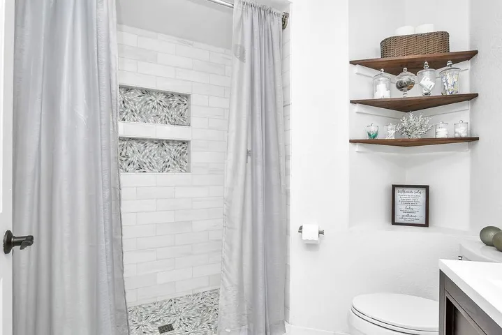 Bathroom featuring a stall shower and vanity