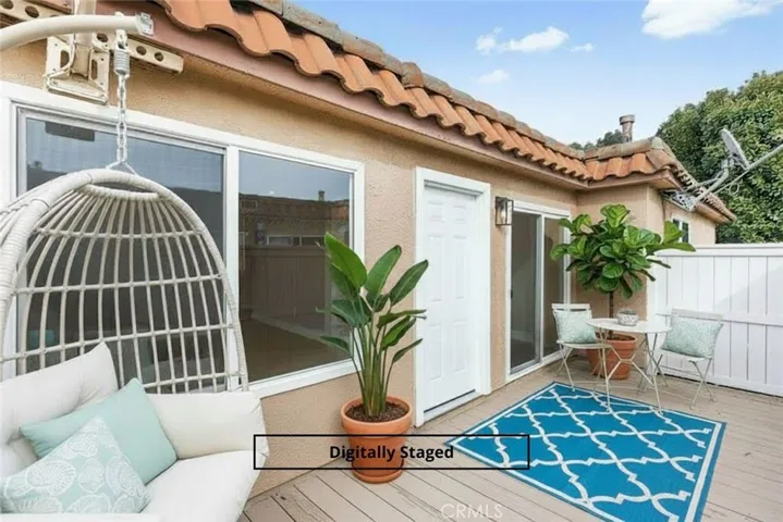 Digitally staged image illustrating patio layout and outdoor living potential.