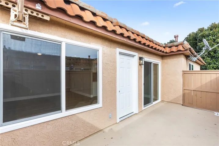 Private outdoor patio showing multiple access points from the interior.