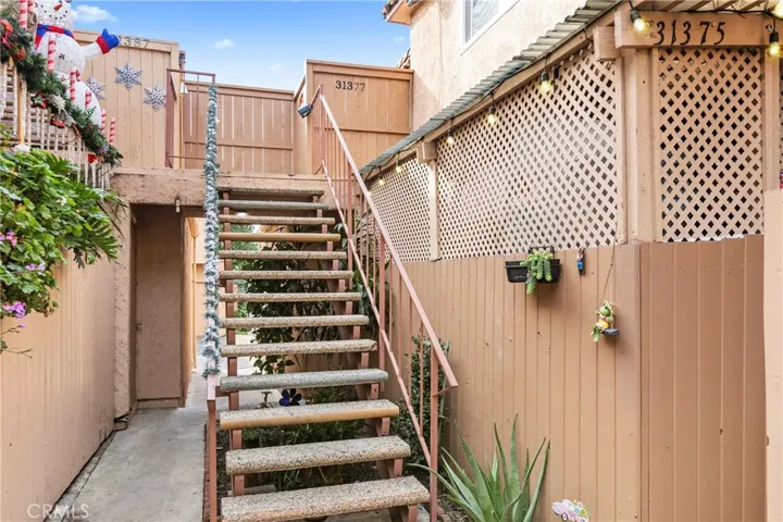 Common stairway and walkway leading to gated residential entries - only 2 condos share this staircase..
