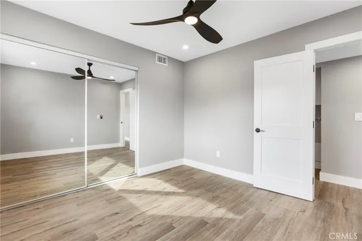 Comfortable bedroom with functional layout and ample storage.