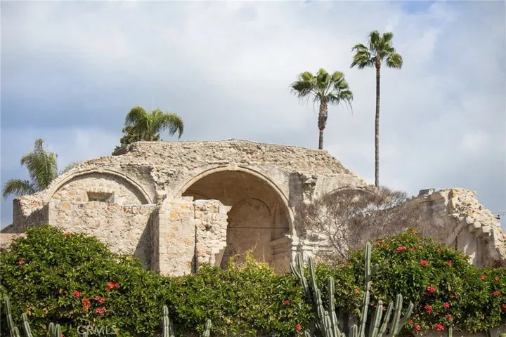 The historic ruins of Mission San Juan Capistrano, where centuries of history still stand beneath the palms.
