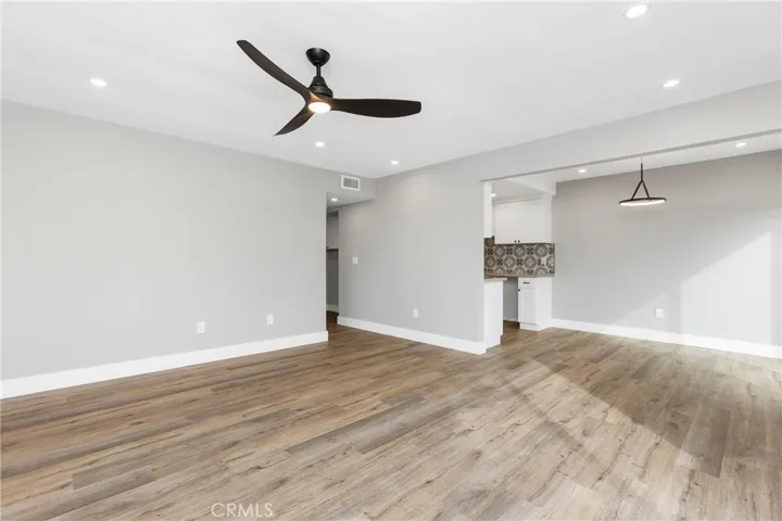 Open-concept living space with clear sightlines to the dining area and kitchen—ideal for flexible furniture placement.