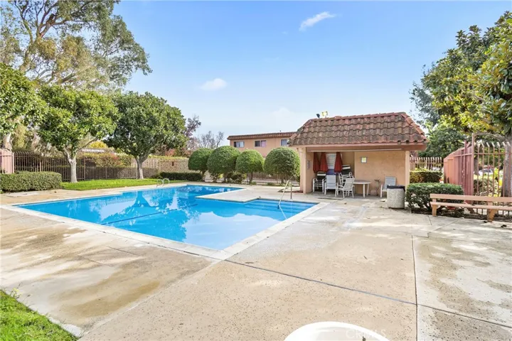 Community swimming pool and clubhouse area.