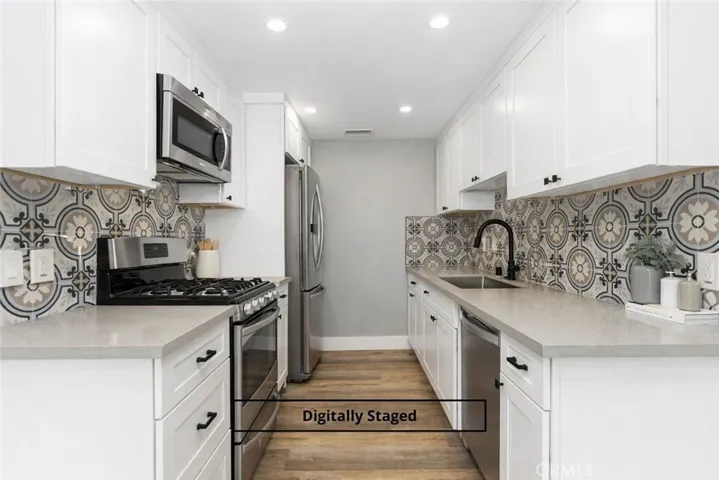 Digitally staged image highlighting the kitchen layout and finishes.