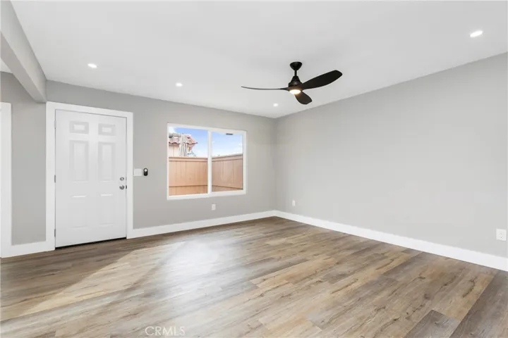Light-filled living area with updated finishes and a neutral palette throughout.