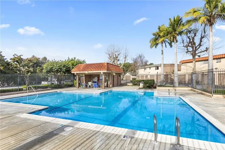 Community swimming pool with surrounding deck area.
