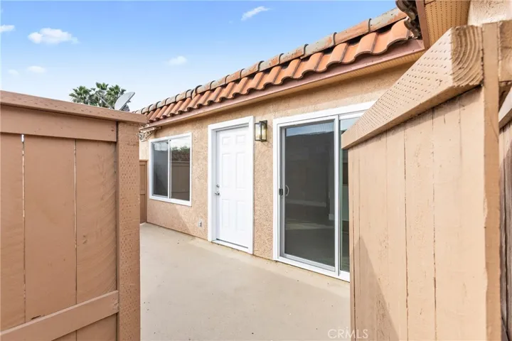 Fully enclosed private patio with gated entry and access to the interior living space.