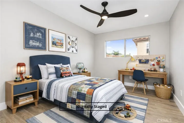 Digitally staged bedroom showcasing flexible space for sleeping, studying, or play, with modern ceiling fan and natural light.