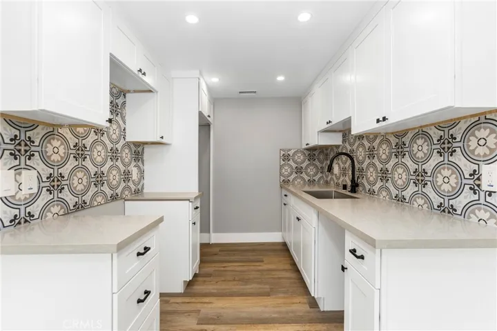 Efficient galley kitchen layout with generous counter space and abundant storage.