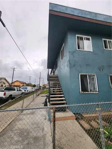 Stairs lead to two units above